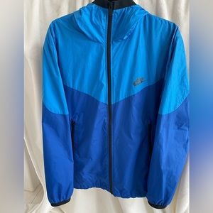 Size large Nike windbreaker with hood.